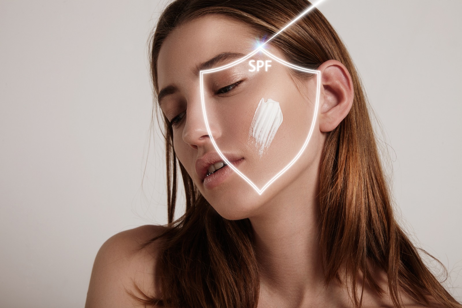 Woman applying sunscreen outdoors: "Dermatologist explains best sunscreen for anti-aging in Chandigarh"